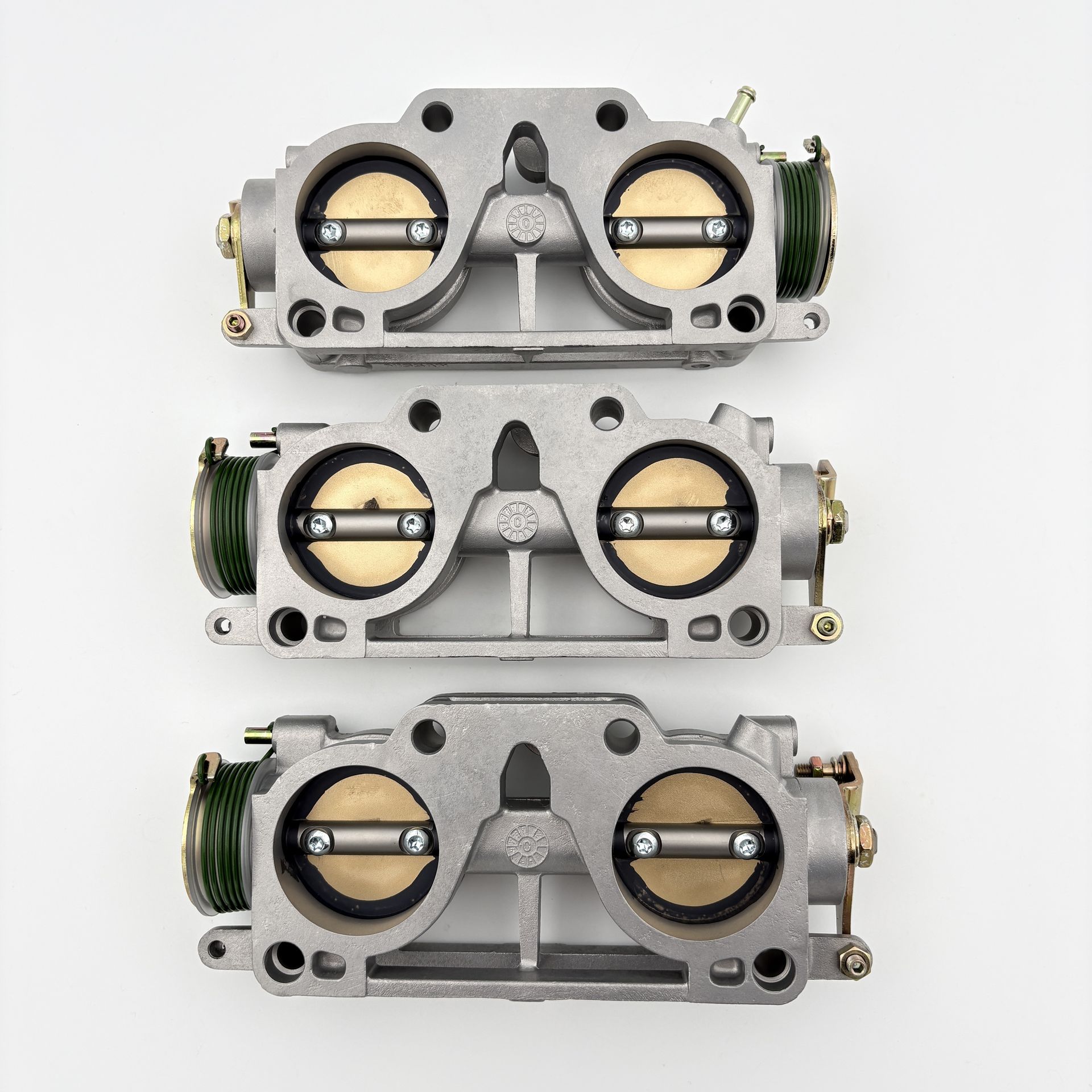 RB26 Throttle Bodies Throttle Bodies - These are the 3 individual throttles which are located between the intake manifold and base manifold